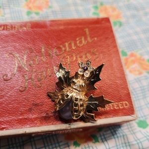 Beautiful beetle broach with a lavender stones.